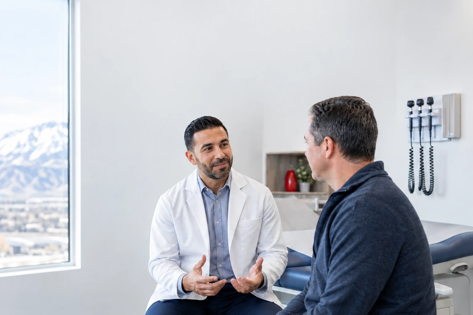 A clinician speaking with an adult patient