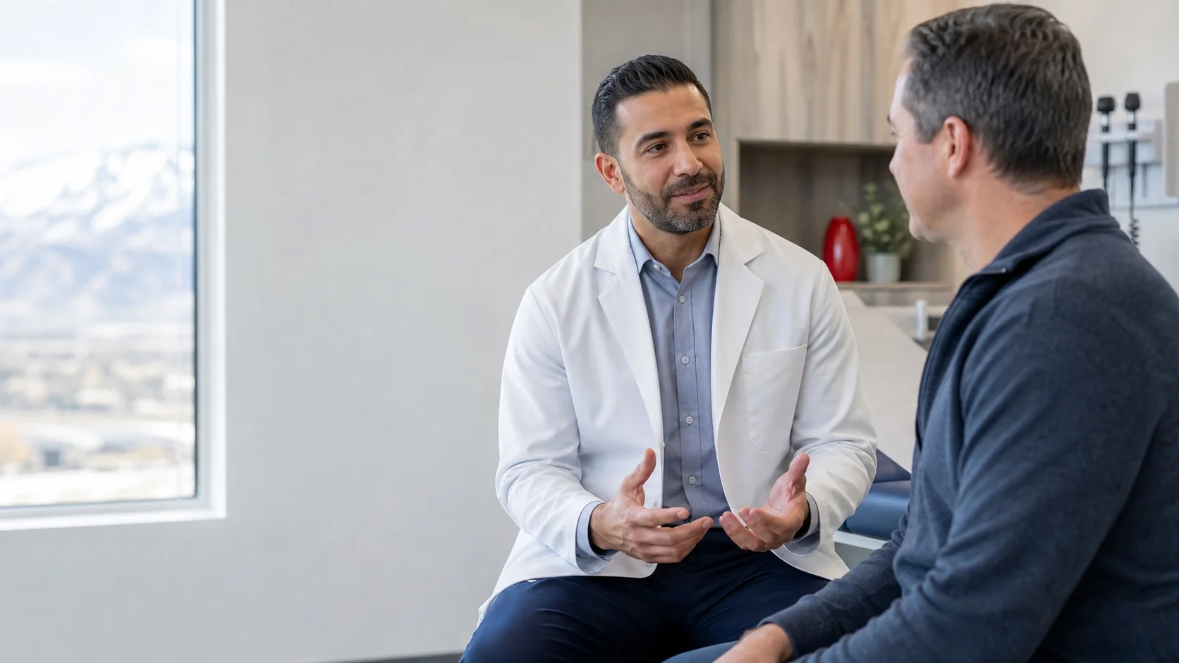 A clinician speaking with an adult patient